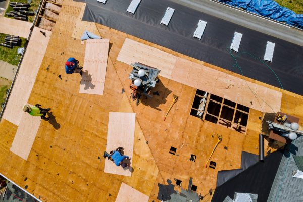 Removal of old roof replacement with new shingles of an apartment building